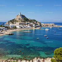 Scenic Coastal View of Calvi Bay with Citadel on Hill and Boats