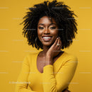Vibrant Woman with Curly Hair Wearing Yellow Sweater and Gold Jewelry