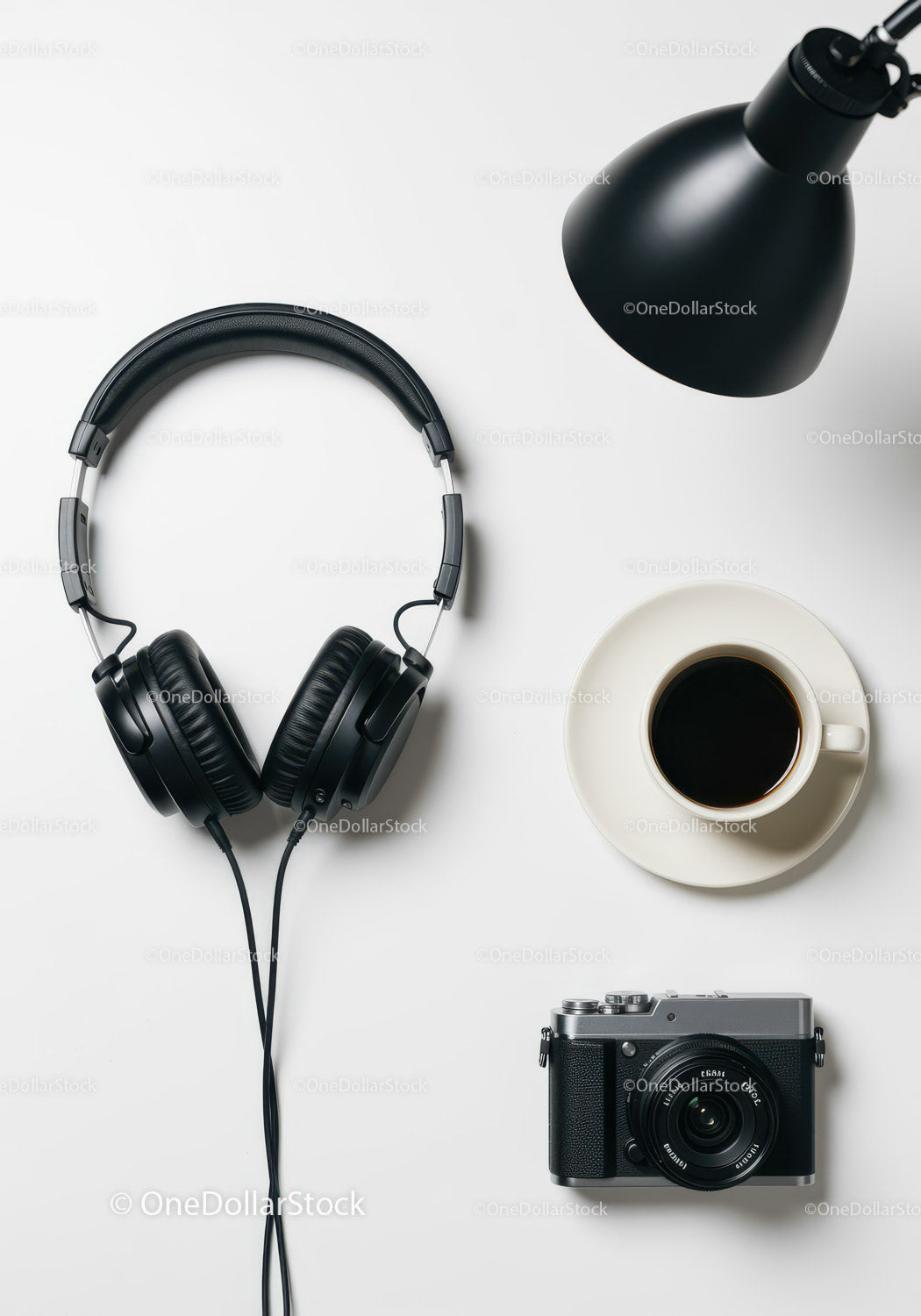 Minimalistic Tech Workspace with Headphones Camera and Coffee