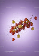 Fresh red grapes with water splash on purple background