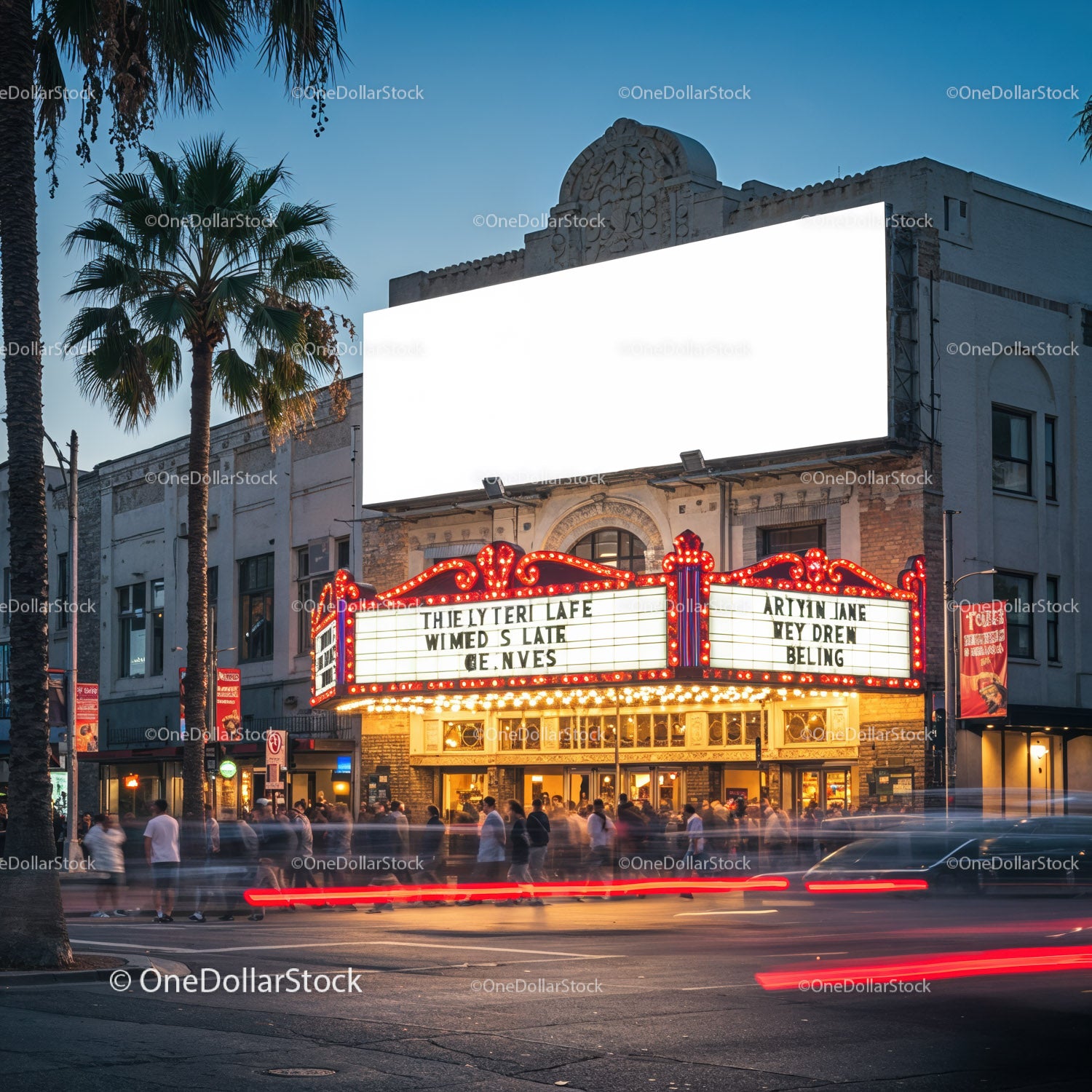 Historic theater marquee glowing on busy city street