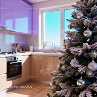 Festive Christmas tree in modern kitchen with natural light