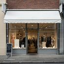 Fashion boutique storefront with modern display windows
