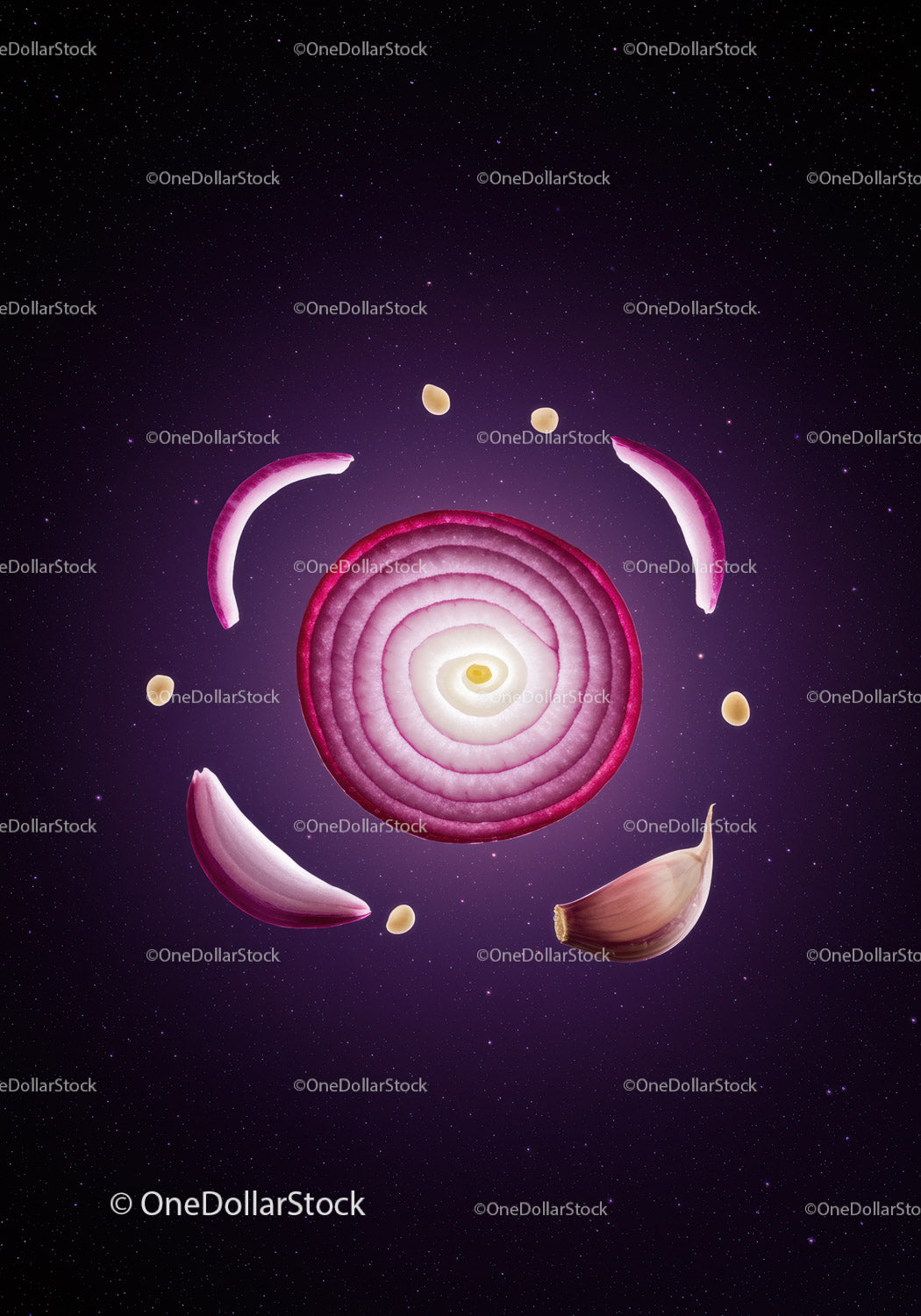 Sliced Red Onion and Garlic Cloves Floating in Space