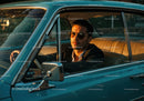 Stylish Man in Sunglasses Sitting in Classic Vintage Car at Sunset