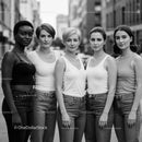Diverse group of women standing together outdoors