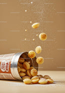 Mini pancake cereal spilling from opened canister