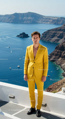 Man in vibrant yellow suit standing on seaside terrace