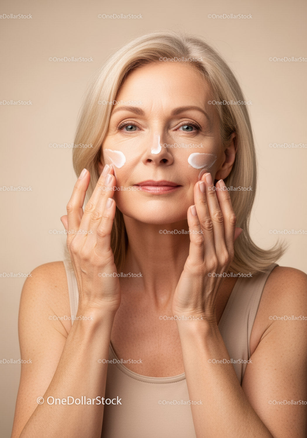 Elegant Mature Woman Applying Skincare Cream for Radiant Skin