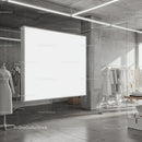 Minimalist fashion showroom with blank illuminated panel