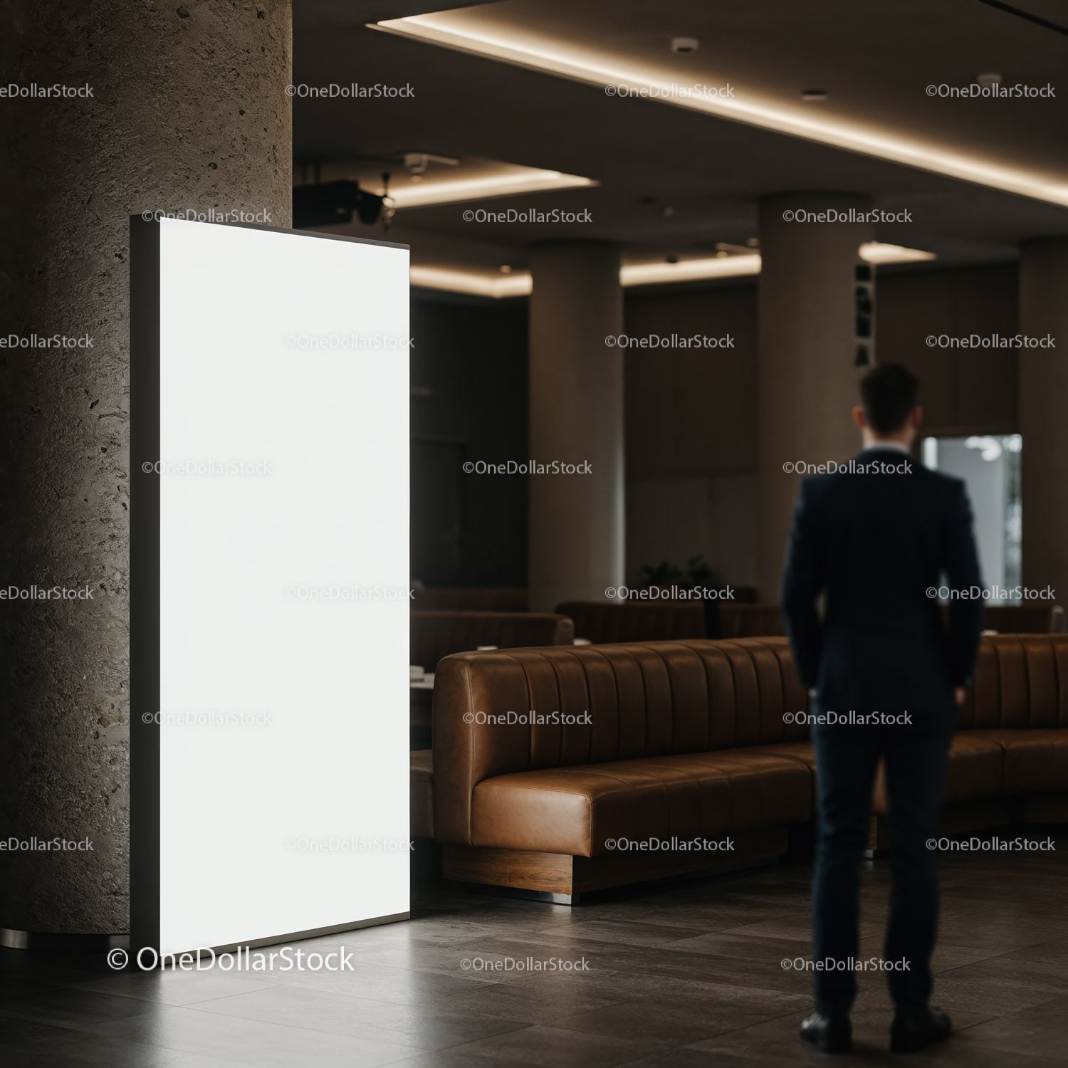 Business professional standing near blank illuminated signboard