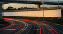 Nighttime Highway with Light Trails and Overpass