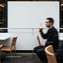 Blurred man drinking coffee at outdoor cafe seating