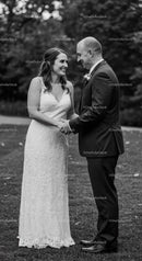 Bride and groom sharing joyful moment outdoors