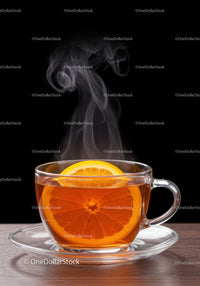 Steaming cup of herbal tea with fresh orange slice