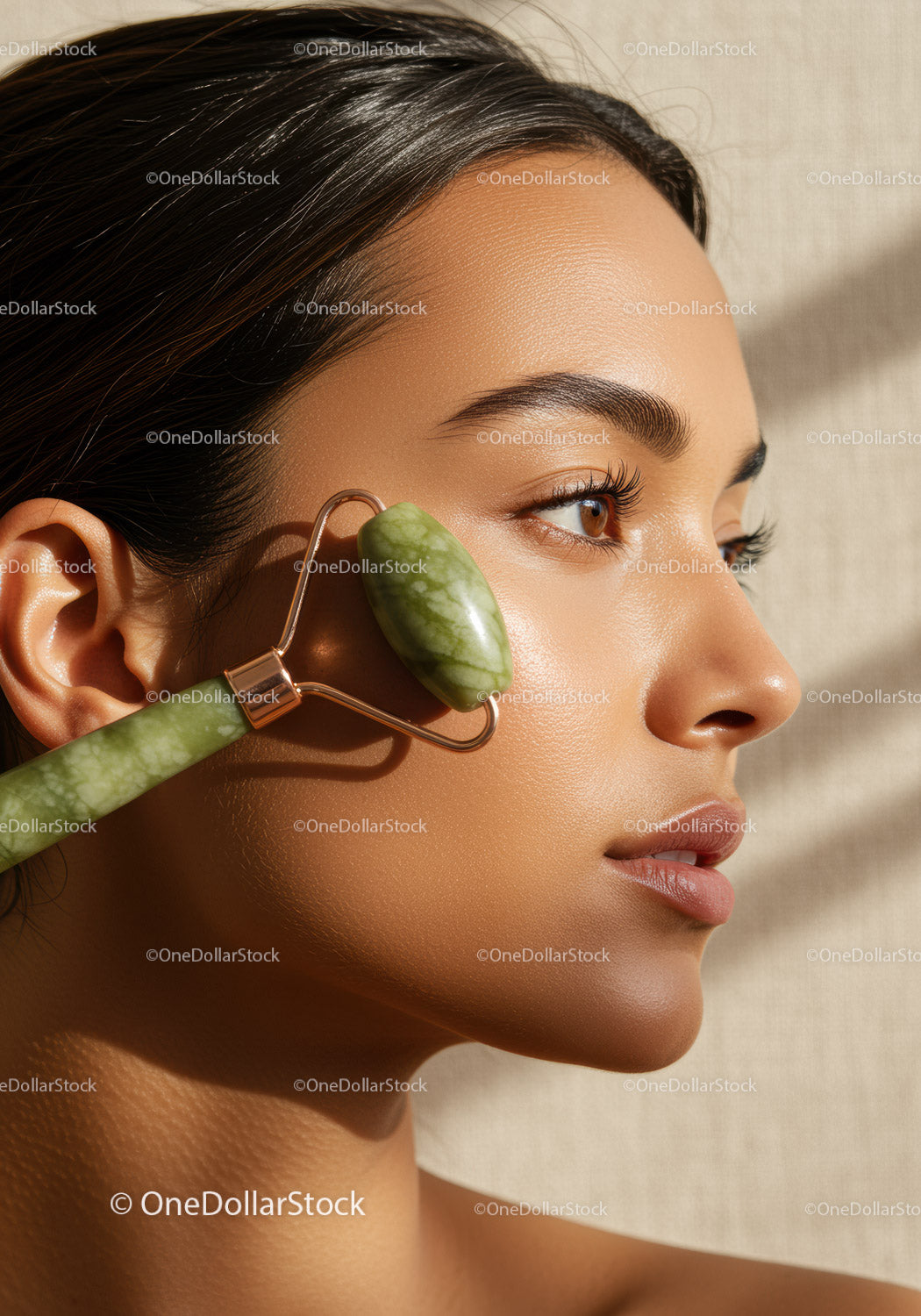 Woman with Jade Roller Performing Facial Massage for Healthy Skin