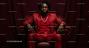 Confident Man in a Bold Red Suit Sitting Elegantly