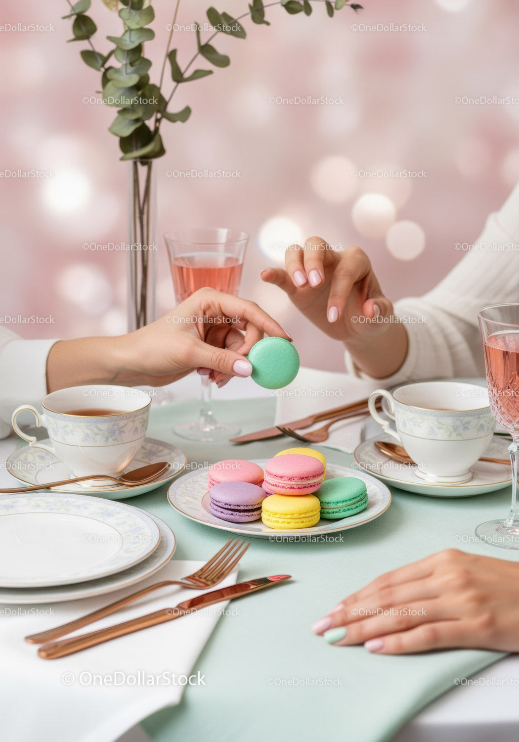 Elegant Pastel Macaron Tea Party Scene with Delicate Tableware and Flowers