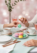 Elegant Pastel Macaron Tea Party Scene with Delicate Tableware and Flowers