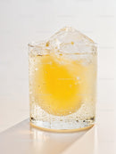 Refreshing cold drink with ice in clear glass