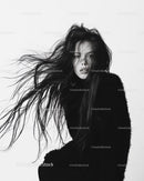 Black and White Portrait of Woman with Flowing Hair in Artistic Studio Setting