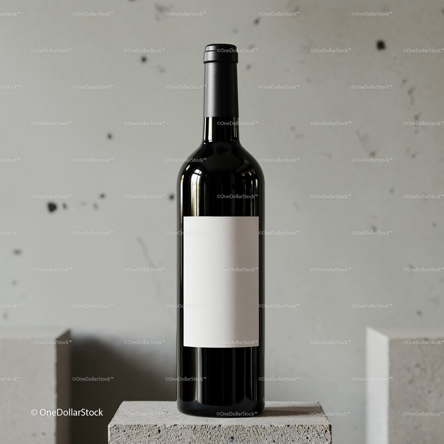 Dark wine bottle with blank label on concrete pedestal
