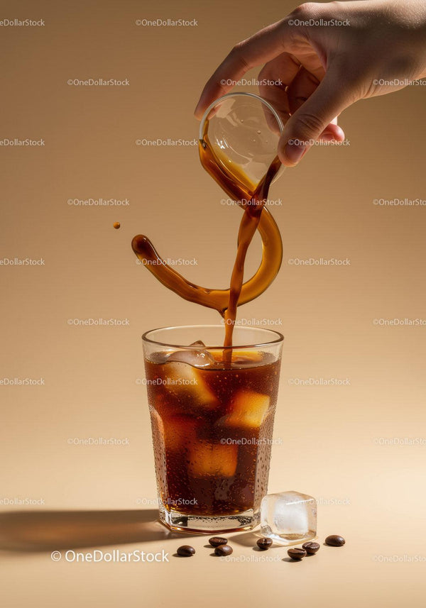 Pouring Cold Brew Coffee Over Ice Cubes