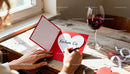 Writing a heartfelt love message on Valentine card