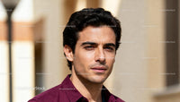 Thoughtful young man in casual shirt outdoors