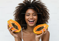 Joyful Woman Holding Fresh Papayas with Bright Smile and Exotic Vibe