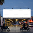 Empty illuminated billboard over evening city street traffic