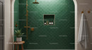 Elegant Green Tiled Shower with Gold Fixtures and Plant