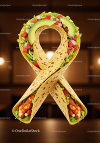 Chicken wrap ribbon with fresh vegetables and avocado slices