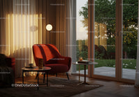 Cozy reading nook with warm lighting near glass doors