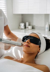 Woman Receiving Laser Skin Rejuvenation Treatment in Modern Clinic