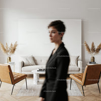 Woman in black blazer in modern living room interior