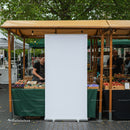 Outdoor market stalls with fresh produce and vendors