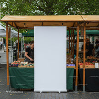 Outdoor market stalls with fresh produce and vendors