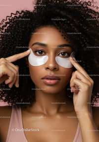 Young Woman with Curly Hair Wearing Facial Under-Eye Patches