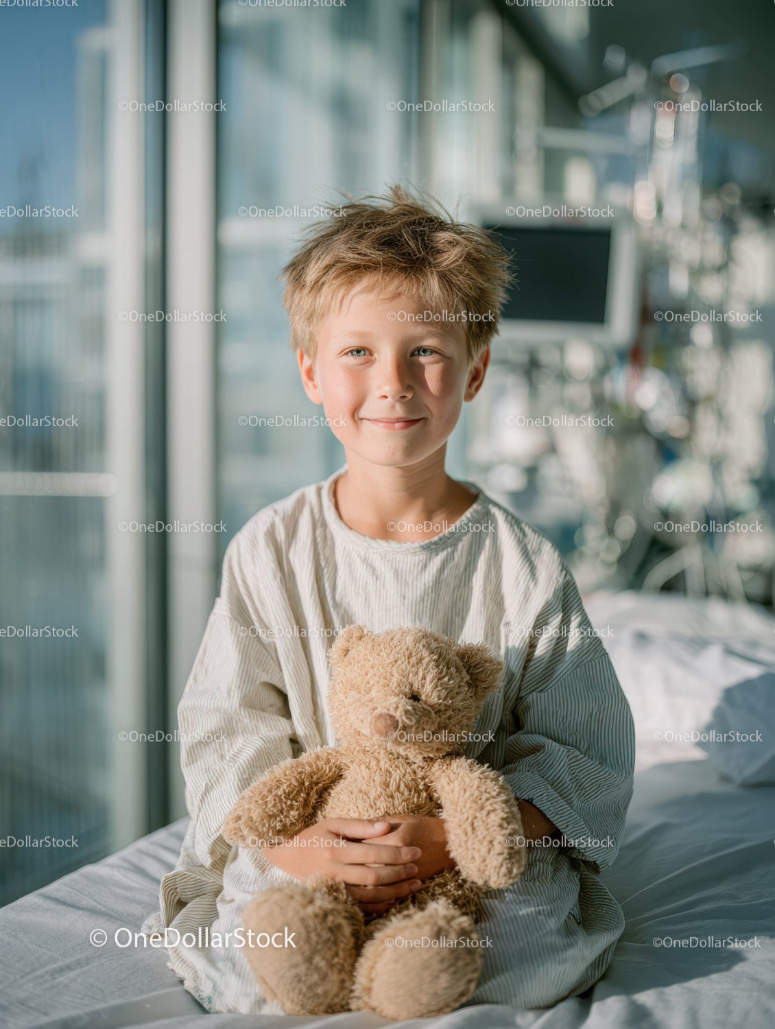 Smiling Child with Teddy Bear in Hospital Room