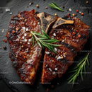 Juicy Grilled Beef Ribs with Herbs on Dark Slate Surface