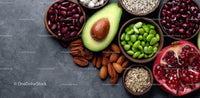 Fresh Assorted Superfoods and Organic Ingredients in Wooden Bowls