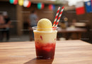 Vibrant Layered Fruit Drink with Ice Cream and Striped Straws