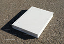 Blank White Hardcover Book on Rough Asphalt Surface