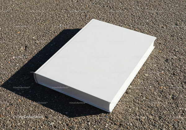 Blank White Hardcover Book on Rough Asphalt Surface JPG Mockup Image