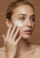 Young Woman Applying Facial Moisturizer for Healthy Glowing Skin