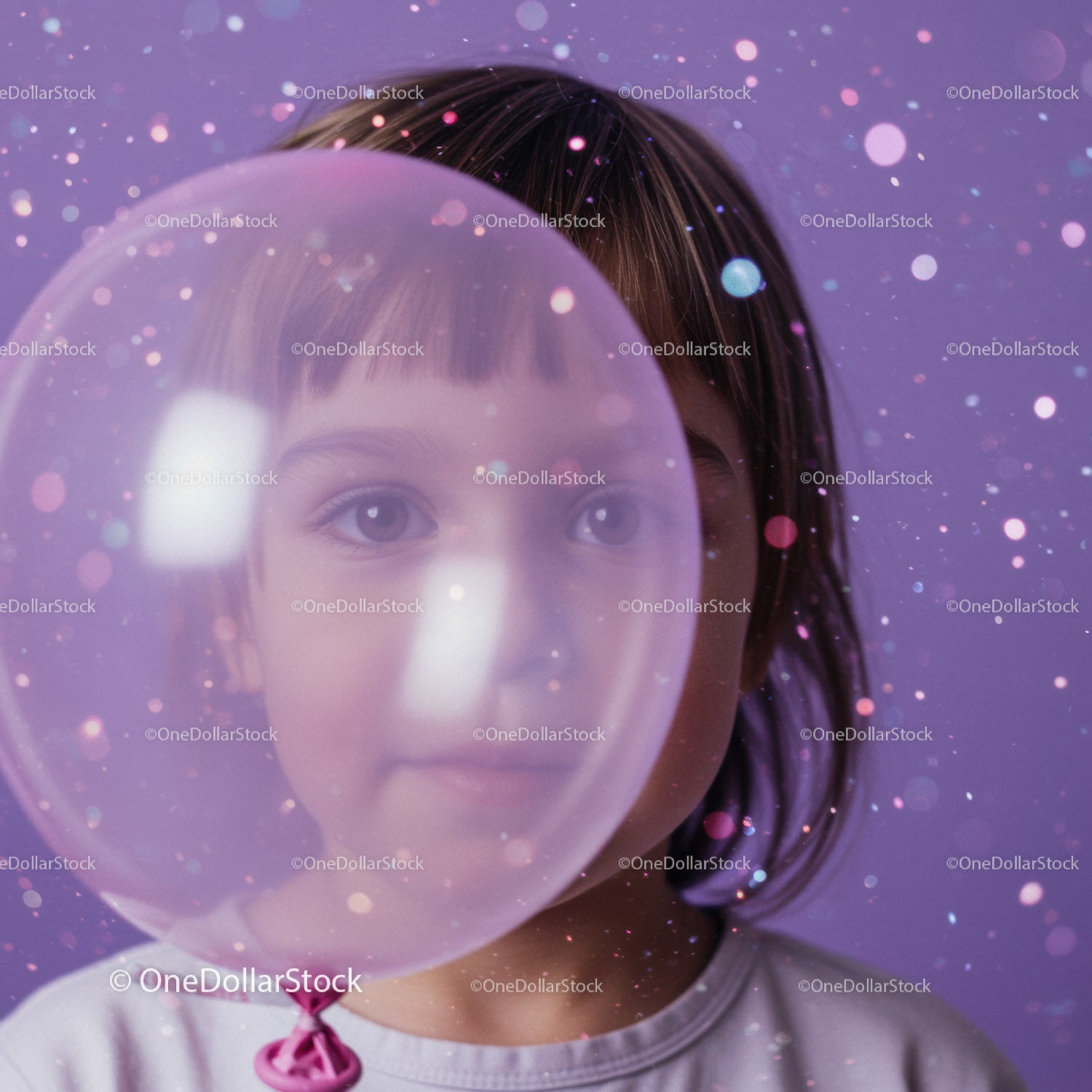 Child gazing through transparent balloon with bokeh lights