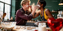 Couple Playfully Baking Heart-Shaped Cookies Together