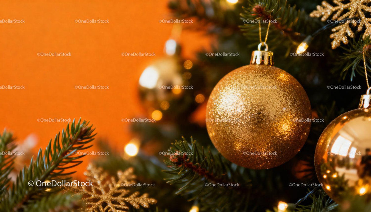 Close-Up of Gold Christmas Ornaments on Pine Tree