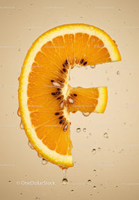 Fresh orange slice with juice droplets on beige background
